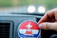 Registered sticker being placed on windshield